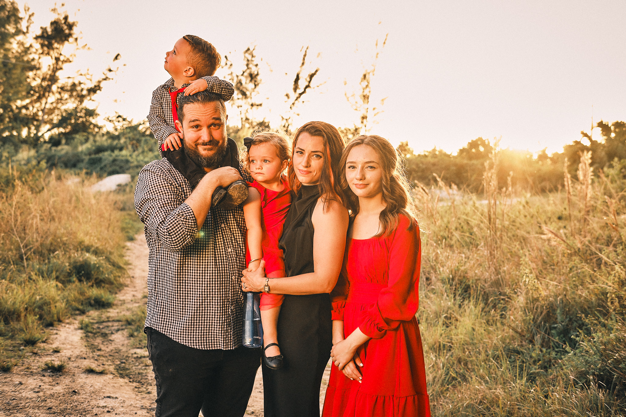 Verklas family enjoying quality time together outdoors during golden hour sunset, illustrating work-life balance and family priorities